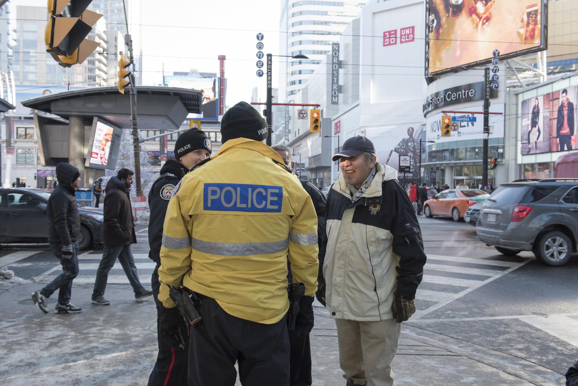 Metro Toronto Police Speaking with a passerby at Yonge and Dundas